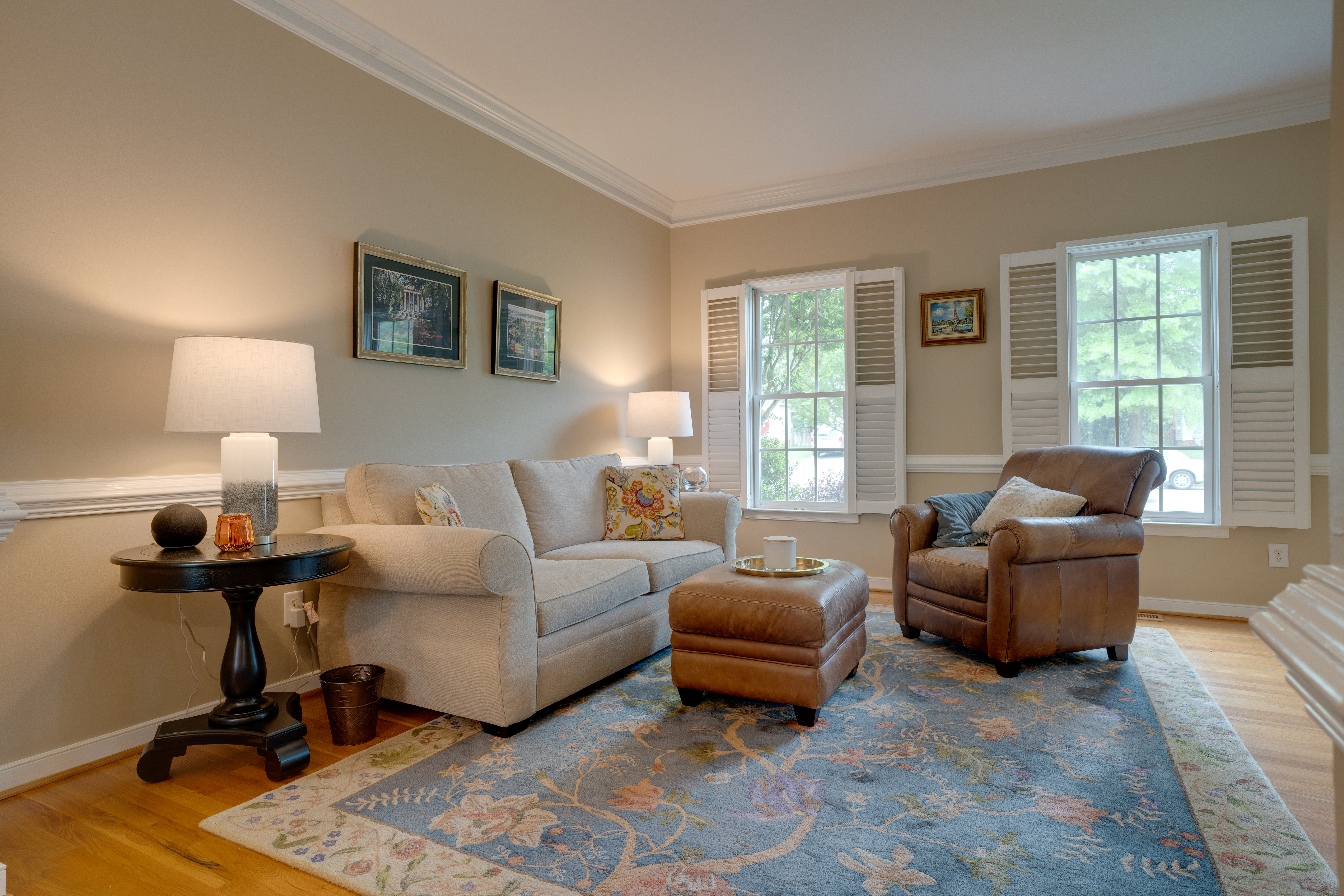Bright living room with shuttered windows