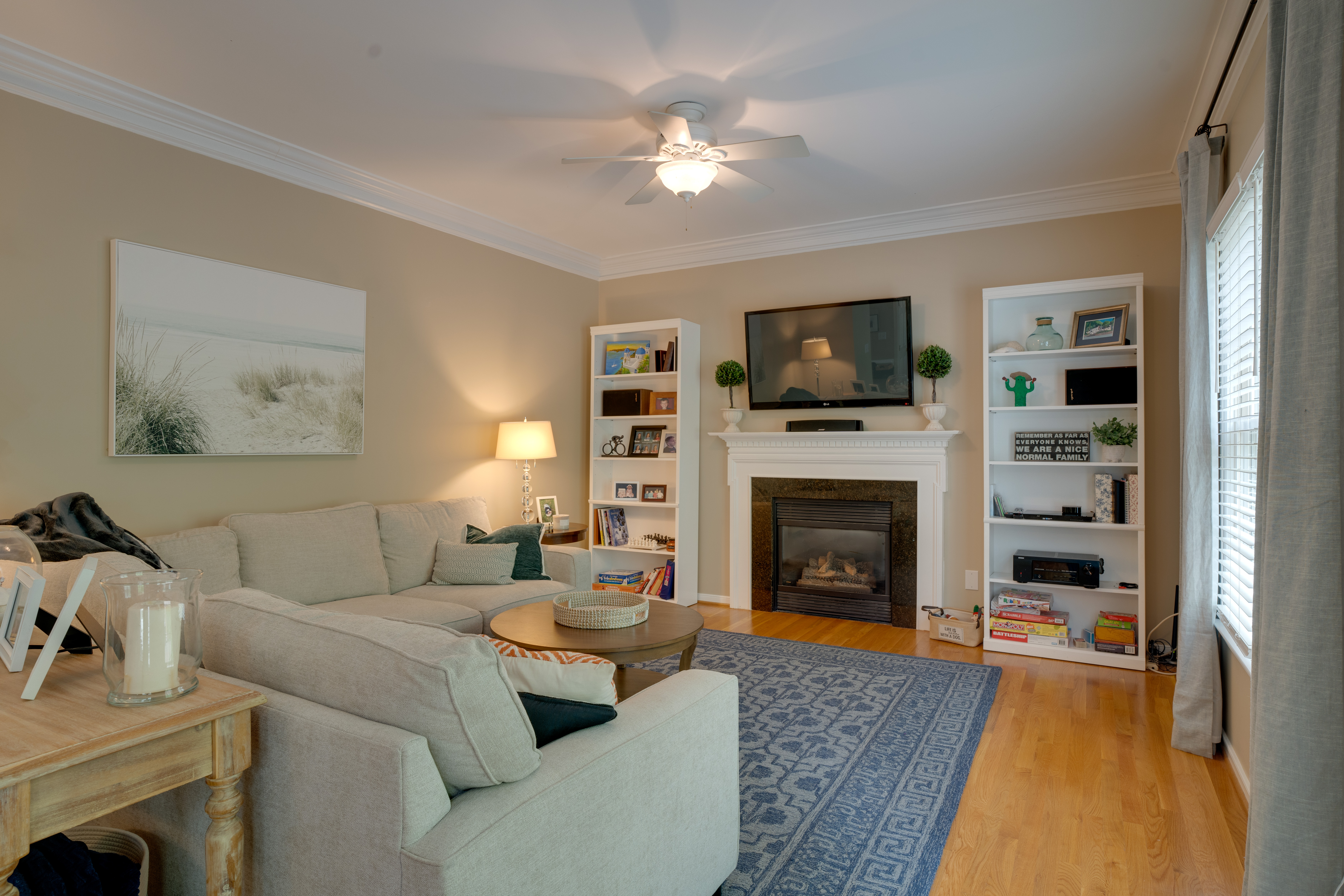 Living room with fireplace and built-in shelves