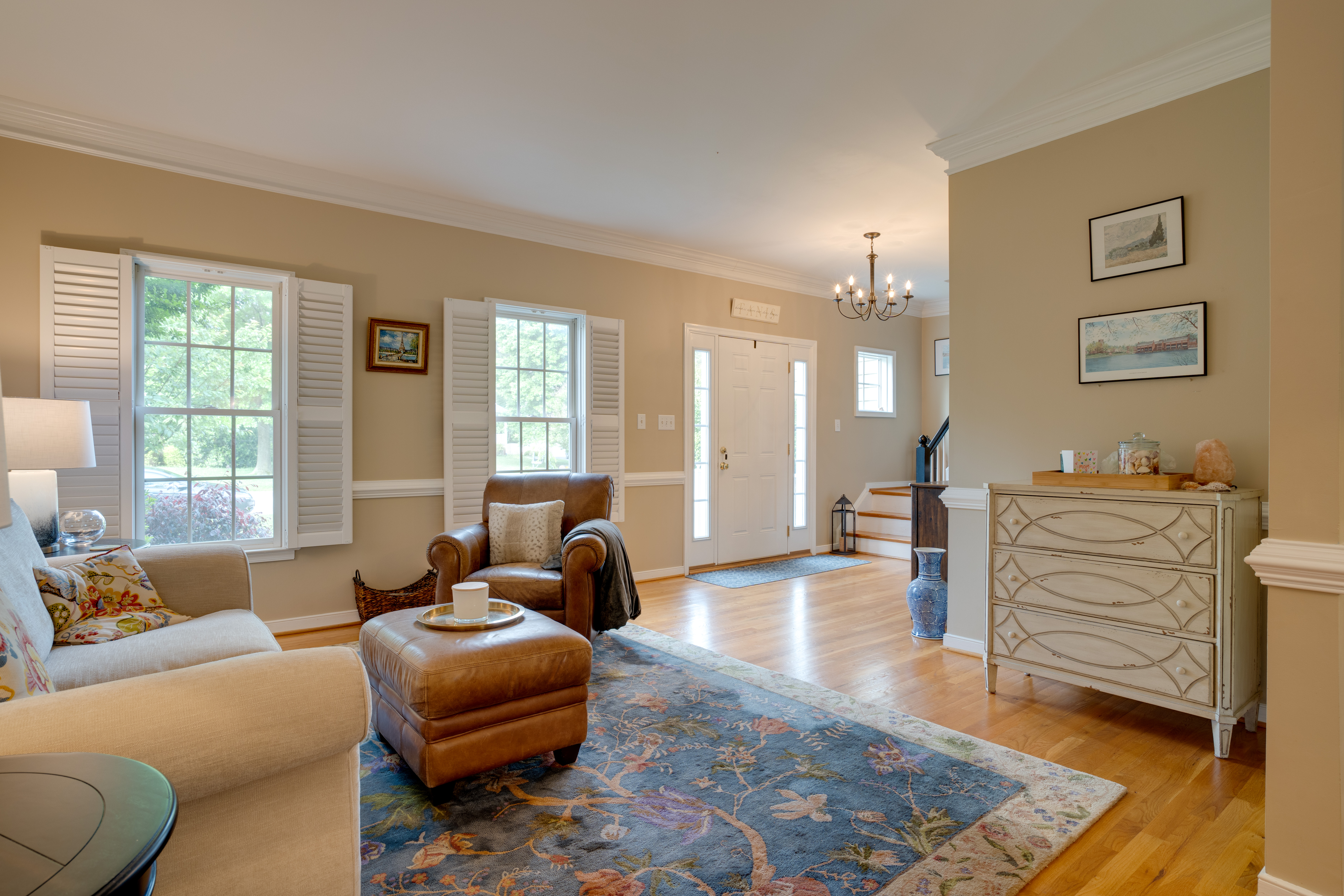 Entry and living room with chandelier
