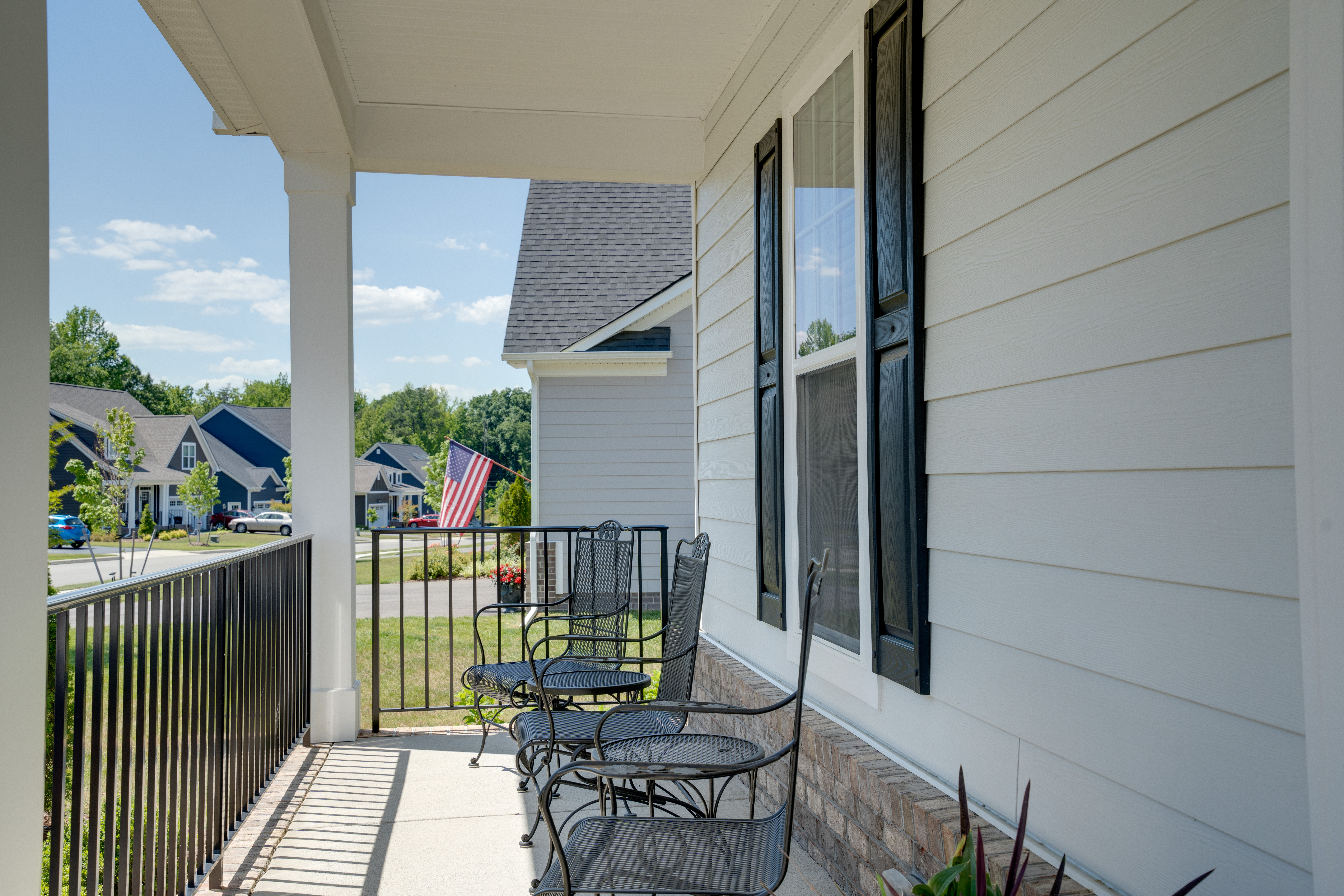 Front porch with wrought iron seating