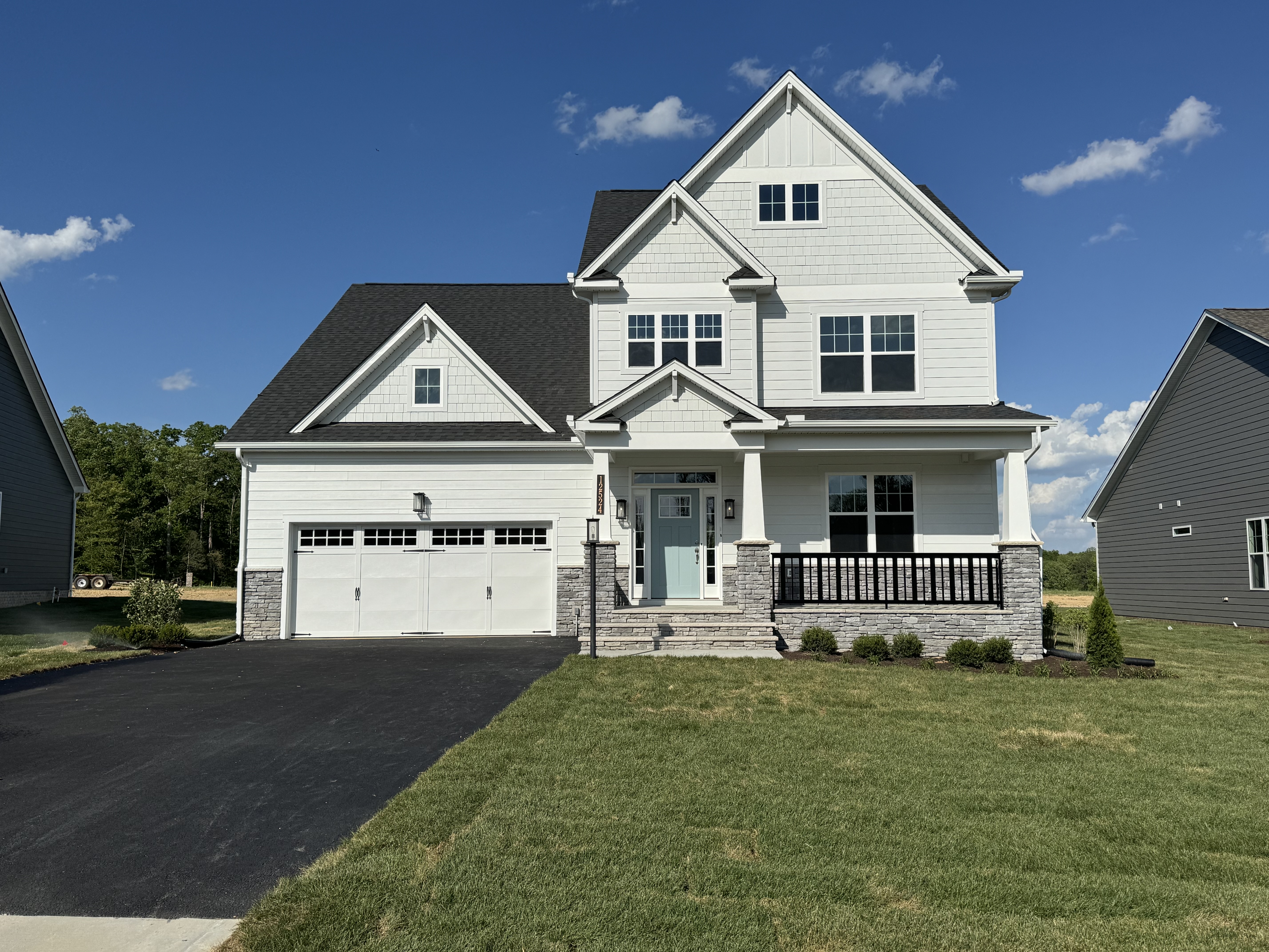 Modern white farmhouse with covered porch